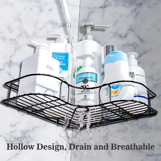 Black corner shower caddy with various bottles on a marble shower wall.