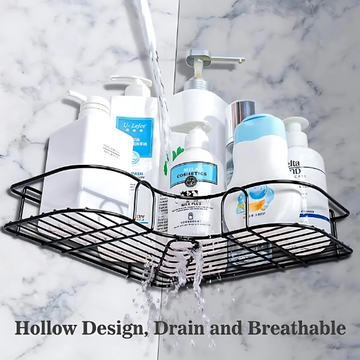 Black corner shower caddy with various bottles on a marble shower wall.