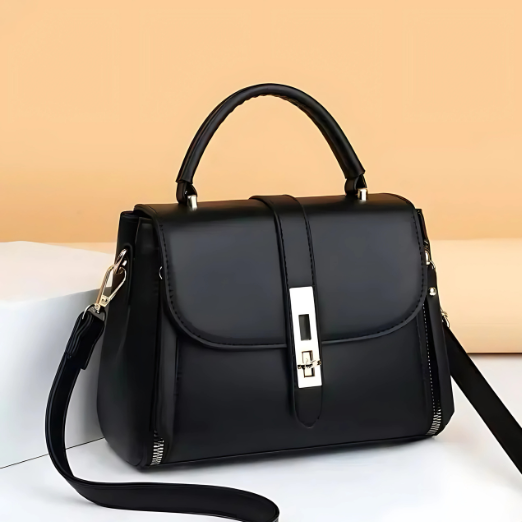 Green handbag with a strap on a white surface with a beige background