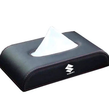 Black tissue holder with a white tissue on a white background, featuring the Suzuki logo.