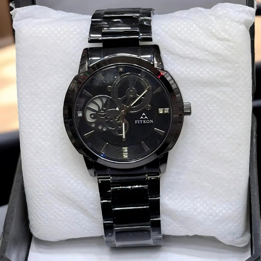 Black wristwatch with silver accents on a white textured surface