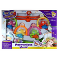 Boxed baby toy with colorful mobile and text indicating musical features