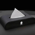 Car tissue holder with Suzuki logo on a black car interior background