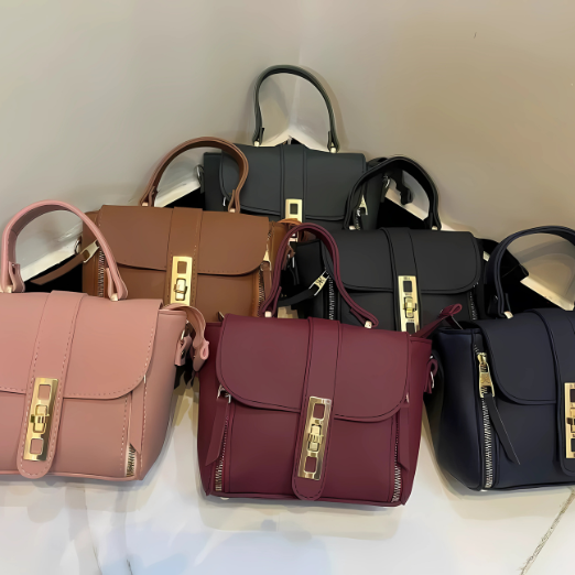 Collection of handbags in various colors with gold hardware 