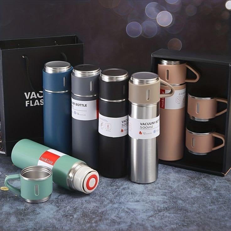 Collection of vacuum flasks and mugs with 'Vacuum Flask' branding on a dark background.