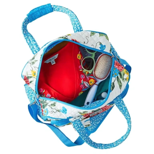 Floral-patterned bag with blue zipper on a white background