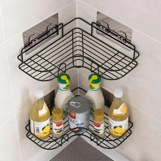 Black corner shower caddy with various bottles on a marble shower wall.