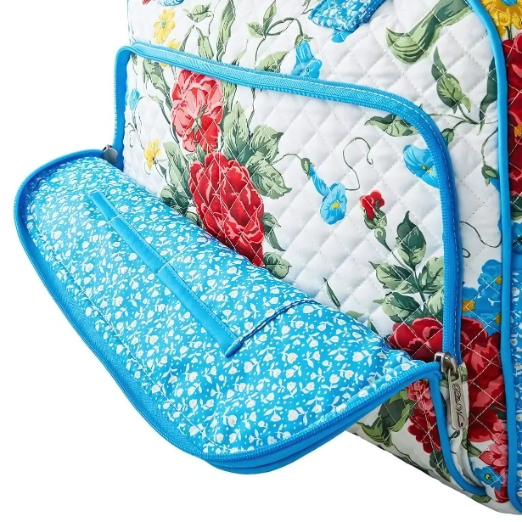 Floral-patterned bag with blue zipper on a white background