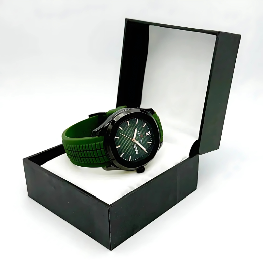 Green watch with a green strap in an open black box on a white background