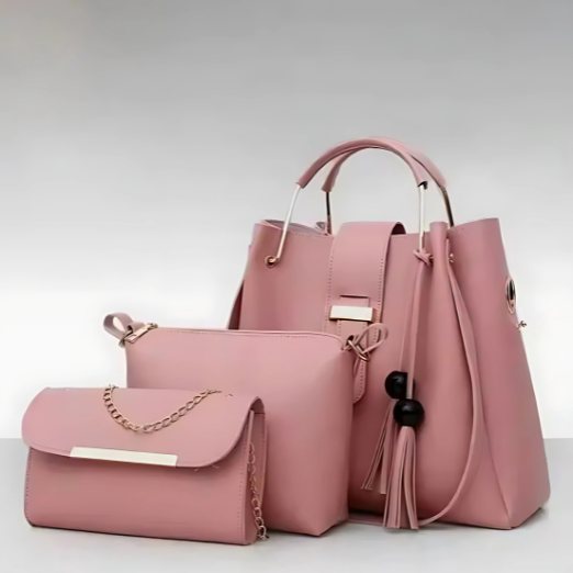 Set of pink handbags with a matching pouch on a light gray background