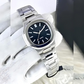 Silver watch with a black face on a marble surface