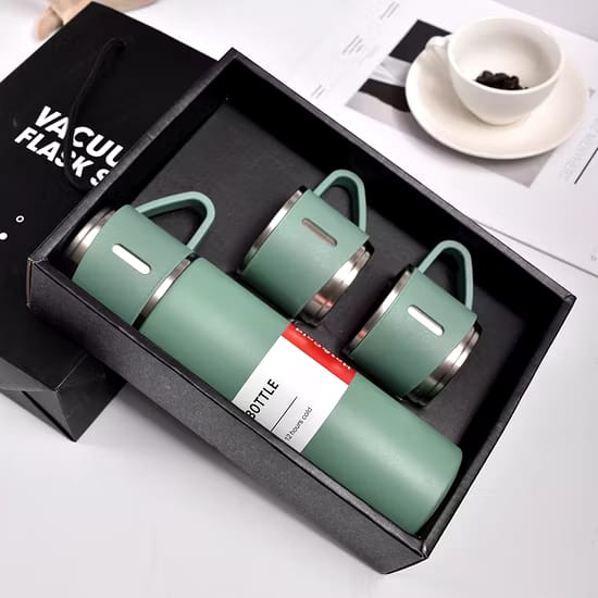 Set of vacuum bottles in various colors on a light background