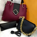 Two handbags, one maroon with a black strap and gold buckle, the other black with a gold chain strap, on a white and orange gradient background.
