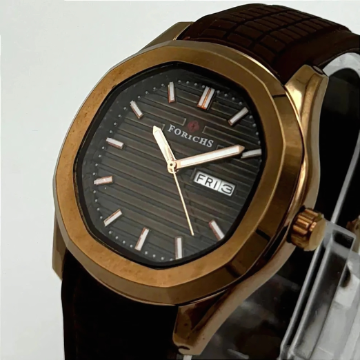 Watch with brown strap and gold case on a light gray background