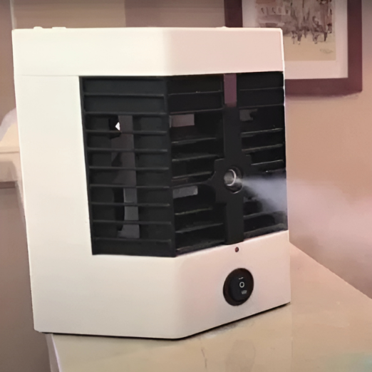 White and black air cooler on a table with a blurred background