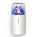 White humidifier with colorful light display on a white background