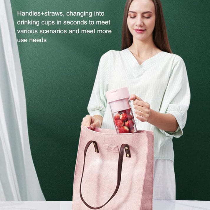 Woman holding a pink reusable cup with a straw, standing next to a pink tote bag on a green background.