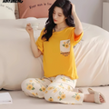 Woman wearing a yellow top and floral pants