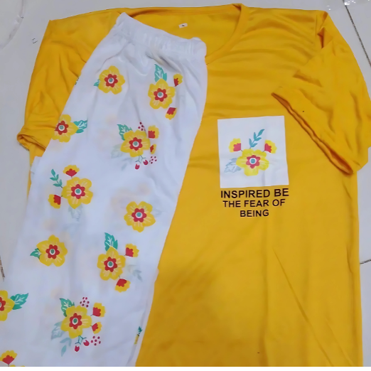 Woman wearing a yellow top and floral pants