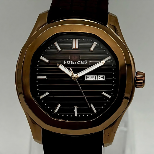 Watch with brown strap and gold case on a light gray background